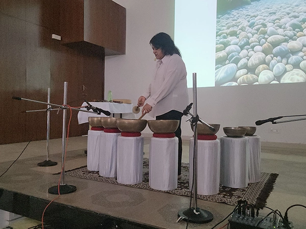 Conduct therapeutic yoga sessions to reduce college-related stress for students at CTT institution.