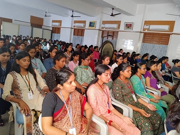 College students participating in yoga and wellness sessions as part of holistic healing in India.