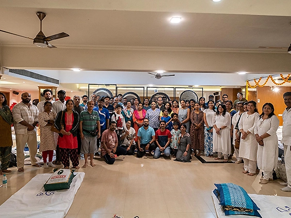 Participants sharing sacred group blessings in a healing circle filled with calm and intention