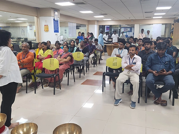 A demonstration-based group yoga session arranged in a setup during the wellness event at SRM.