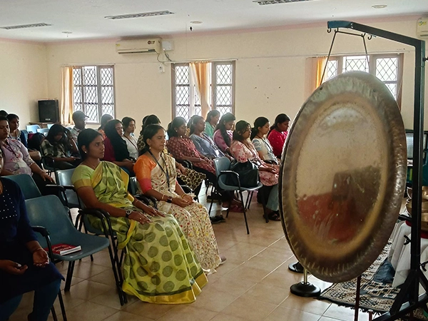 Engaged audience attending a healing therapy session focused on relaxation and spiritual balance.