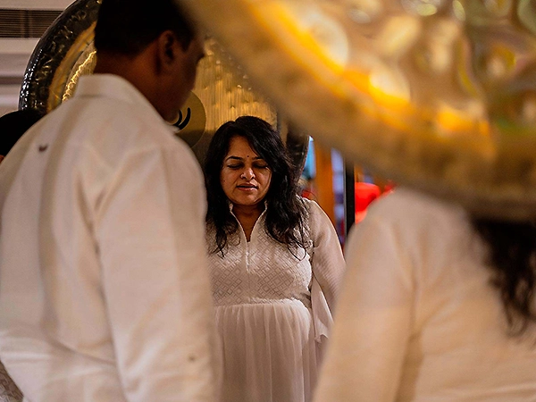 Participants receiving sound-based healing through calming instruments and gentle tones