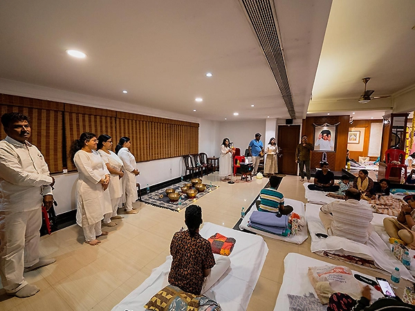 Group meditating together in stillness, creating a powerful atmosphere of peace and unity