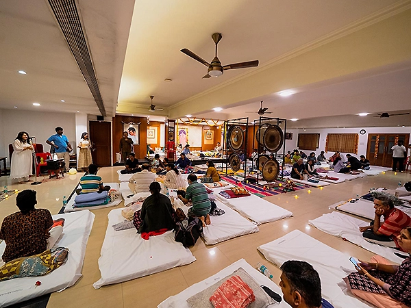 Meditation space thoughtfully arranged with cushions, mats, soft lighting, and healing tools