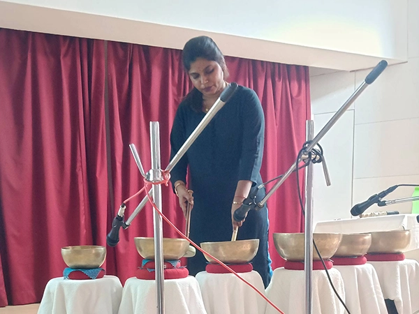 An outdoor wellness session led by therapists takes place in open campus space at the Stella Maris