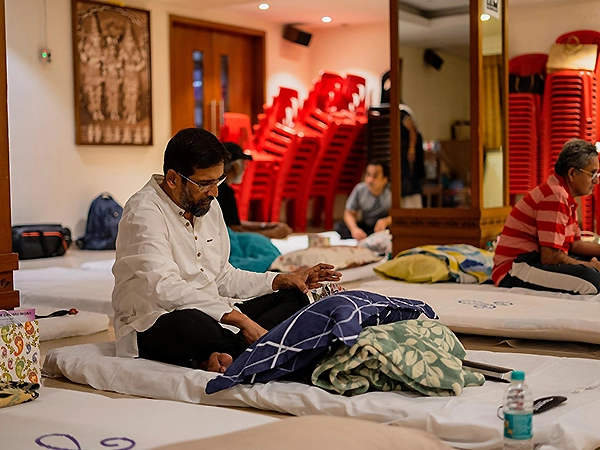 A participant resting peacefully after reaching deep relaxation through gentle meditation