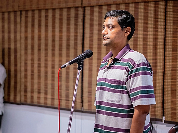 A healing circle where individuals share stories and connect through heartfelt words