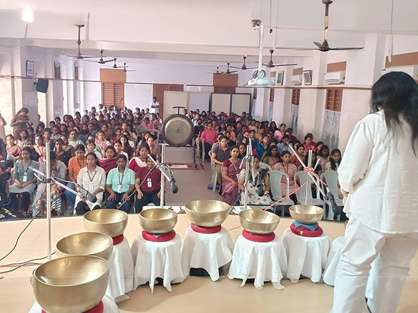 Explanation of sound healing therapy shared with college students to promote energy balance in India.