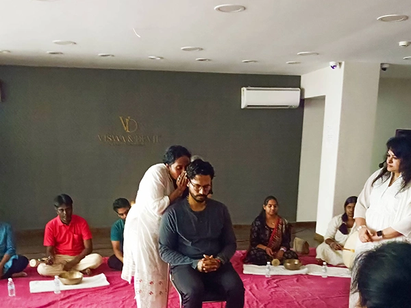Experts guide participants through sound vibration therapy sessions to harmonize body and mind.