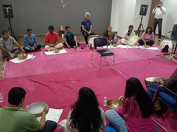 Facilitators conduct a spiritual sound bath with blessings to support healing \and deep inner peace
