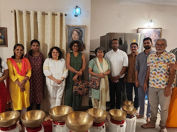 Participants practicing deep sound meditation session during the gong healing therapy in Tamil Nadu