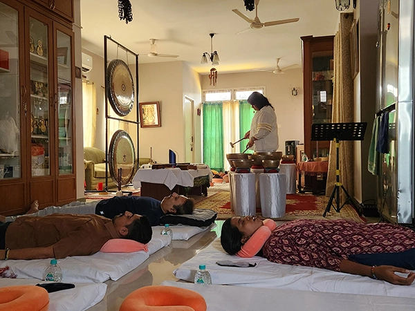 Gong bowls and therapeutic instruments arranged for a relaxing sound healing session by Satvat.